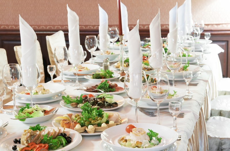 catering table set service with silverware, napkin and glass at
